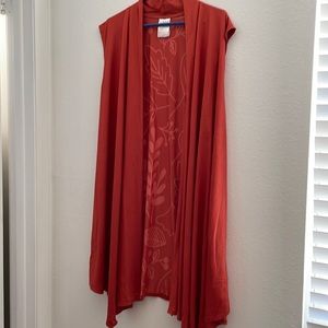 Vest sleeveless. 3/4 length. NWOT